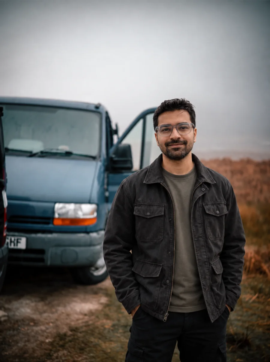 James standing beside the family's 2014 Sprinter van